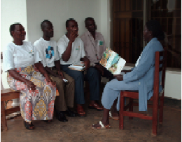 Jussy (on the right) with peers during a group discussion about positive living