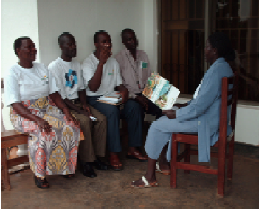 Jussy (on the right) with peers during a group discussion about positive living