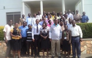 Insurance Group Agents, Health Partners and ICOBI staff pose for a photo with the Minister of State for Health (General Duties) during the training on Community Health Insurance